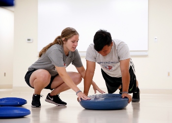 Two People Practicing Sports Science