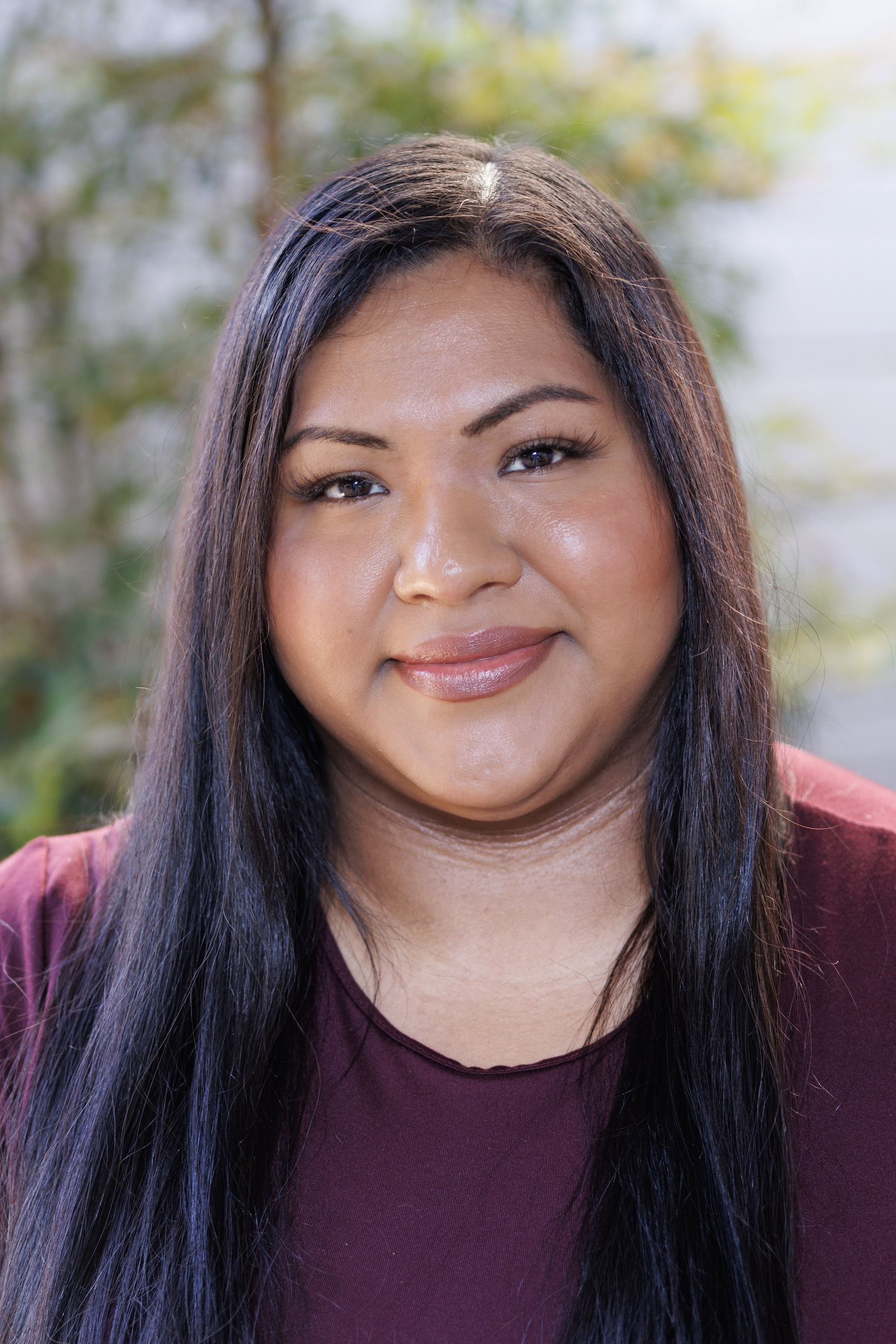 Smiling woman with long black hair