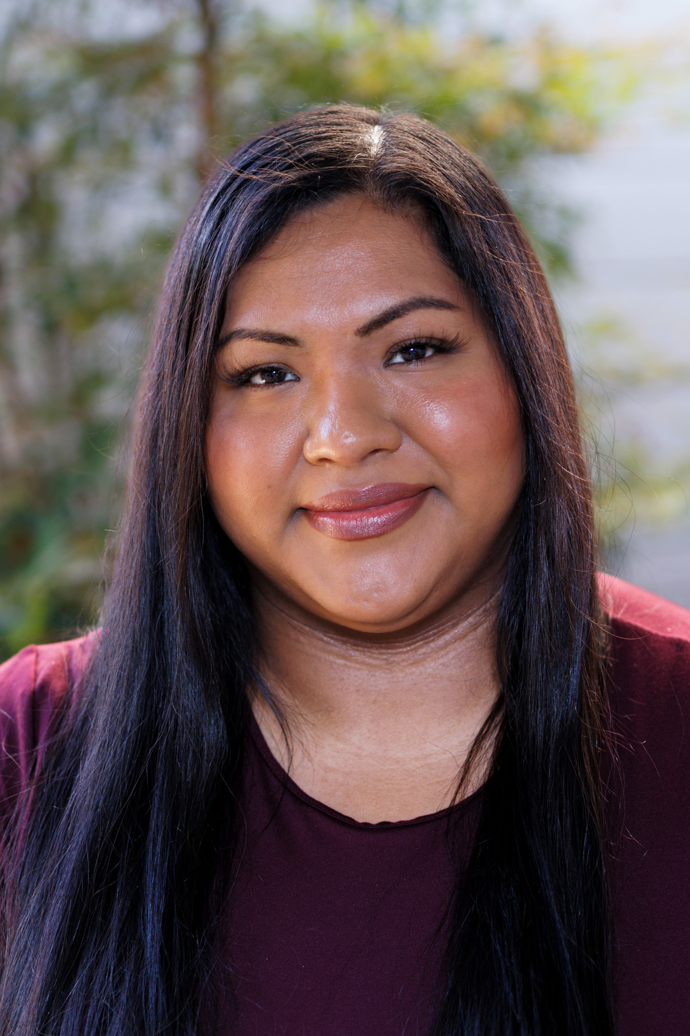 Smiling woman with long black hair