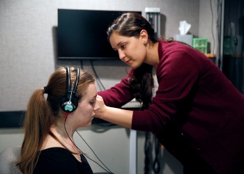 Woman taking an Auditory Test