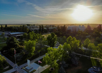 Overhead image of Fresno State campus with sun setting in distance