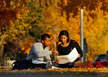 Two Students Studying Outside on Campus