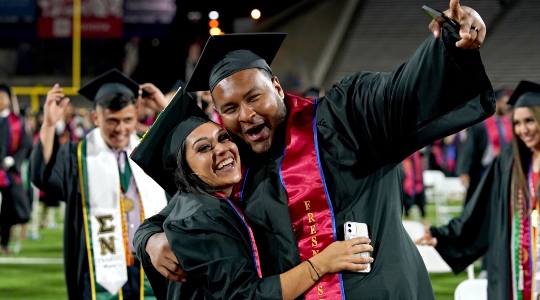 Fresno State graduates smiling