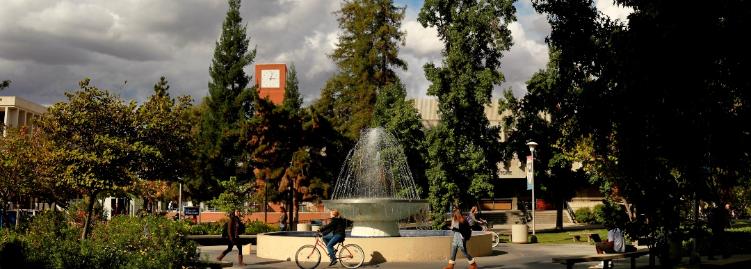 Students biking through Fresno State campus